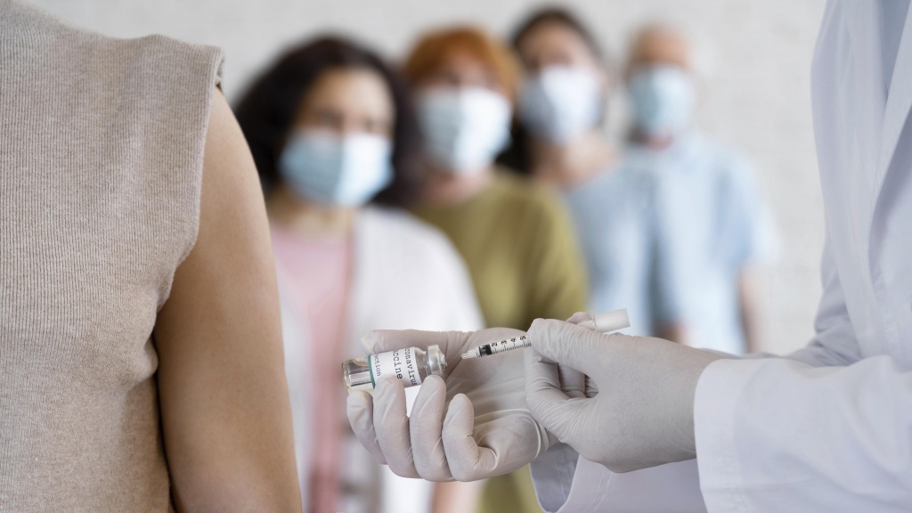 woman-getting-vaccine-shot-by-doctor.jpg